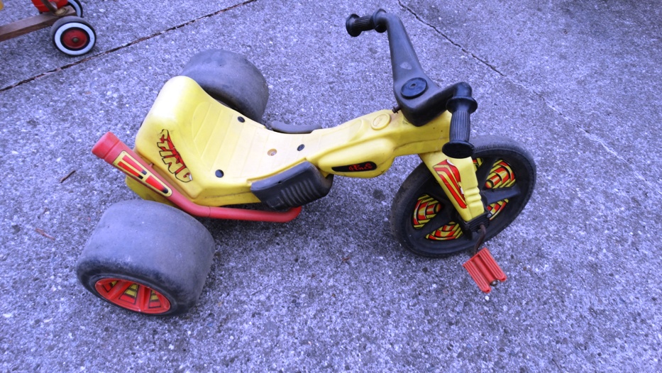 Group of Vintage Scooters and Other Wheeled Toys