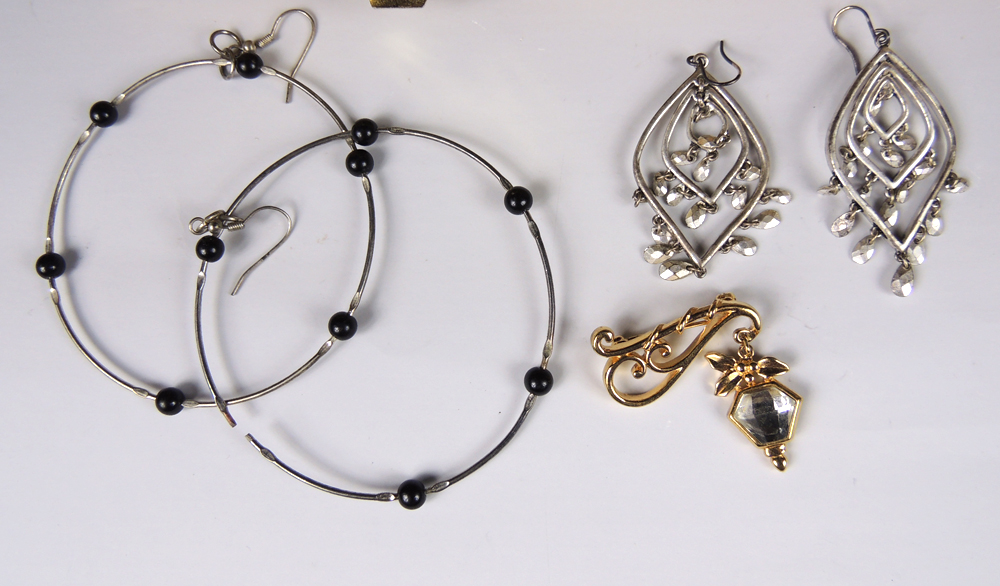 Large Assortment of Costume Jewelry with Display Case