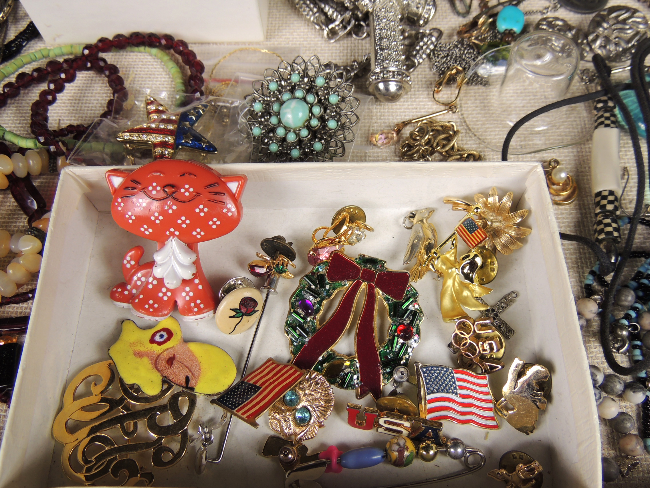 Large Assortment of Costume Jewelry with Display Case