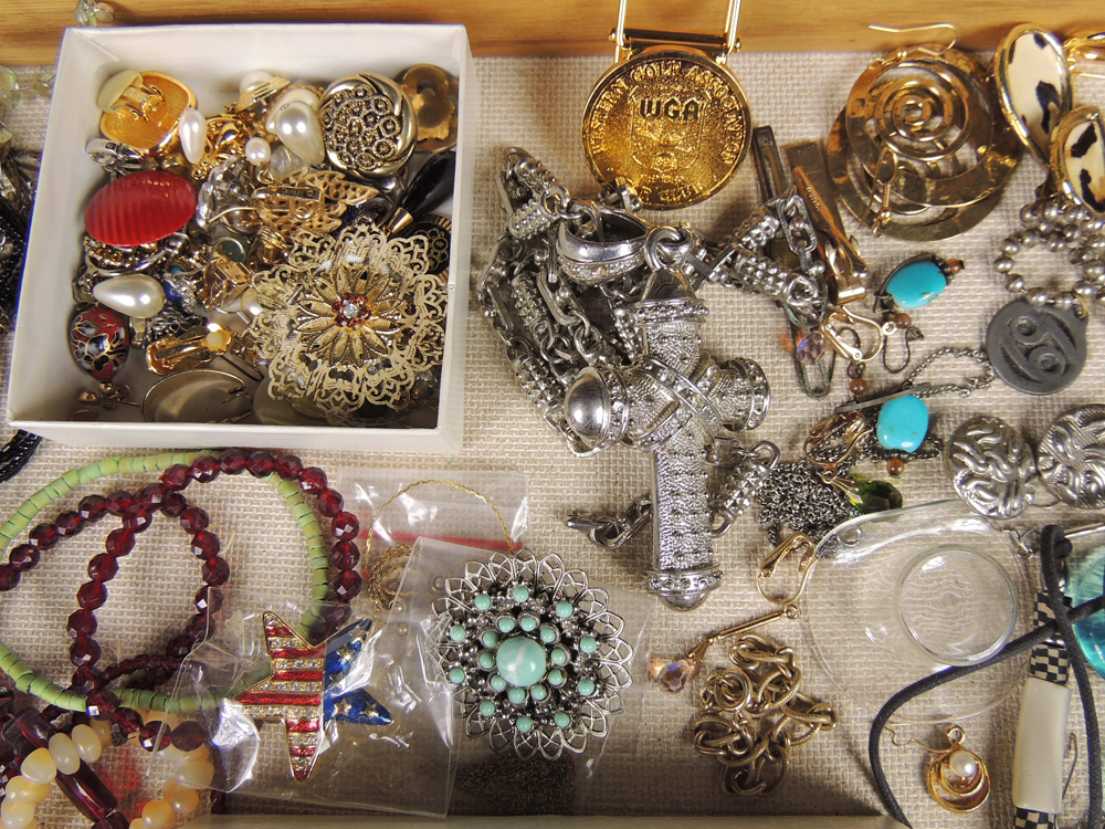 Large Assortment of Costume Jewelry with Display Case