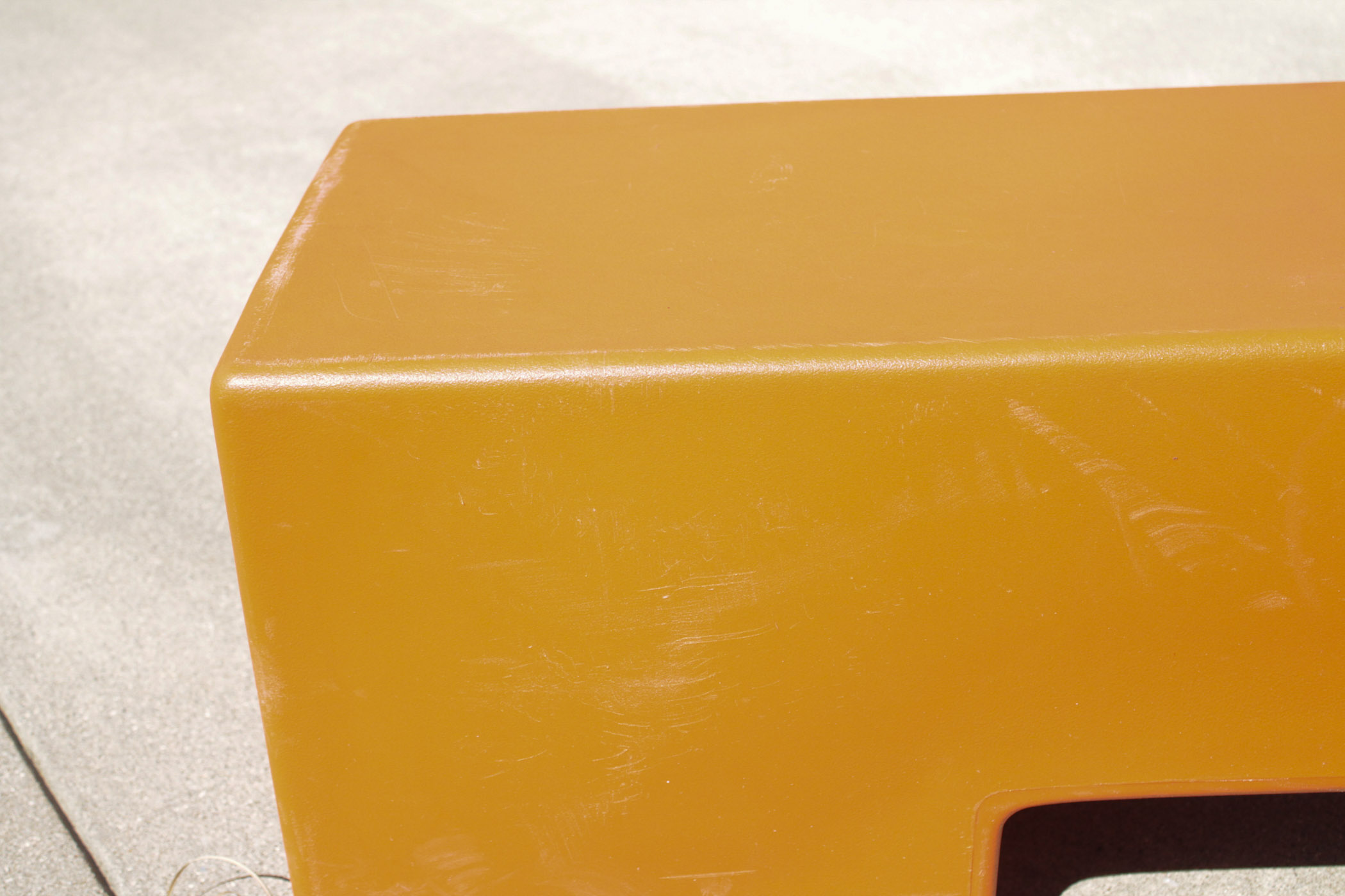 Orange Molded Plastic Bench
