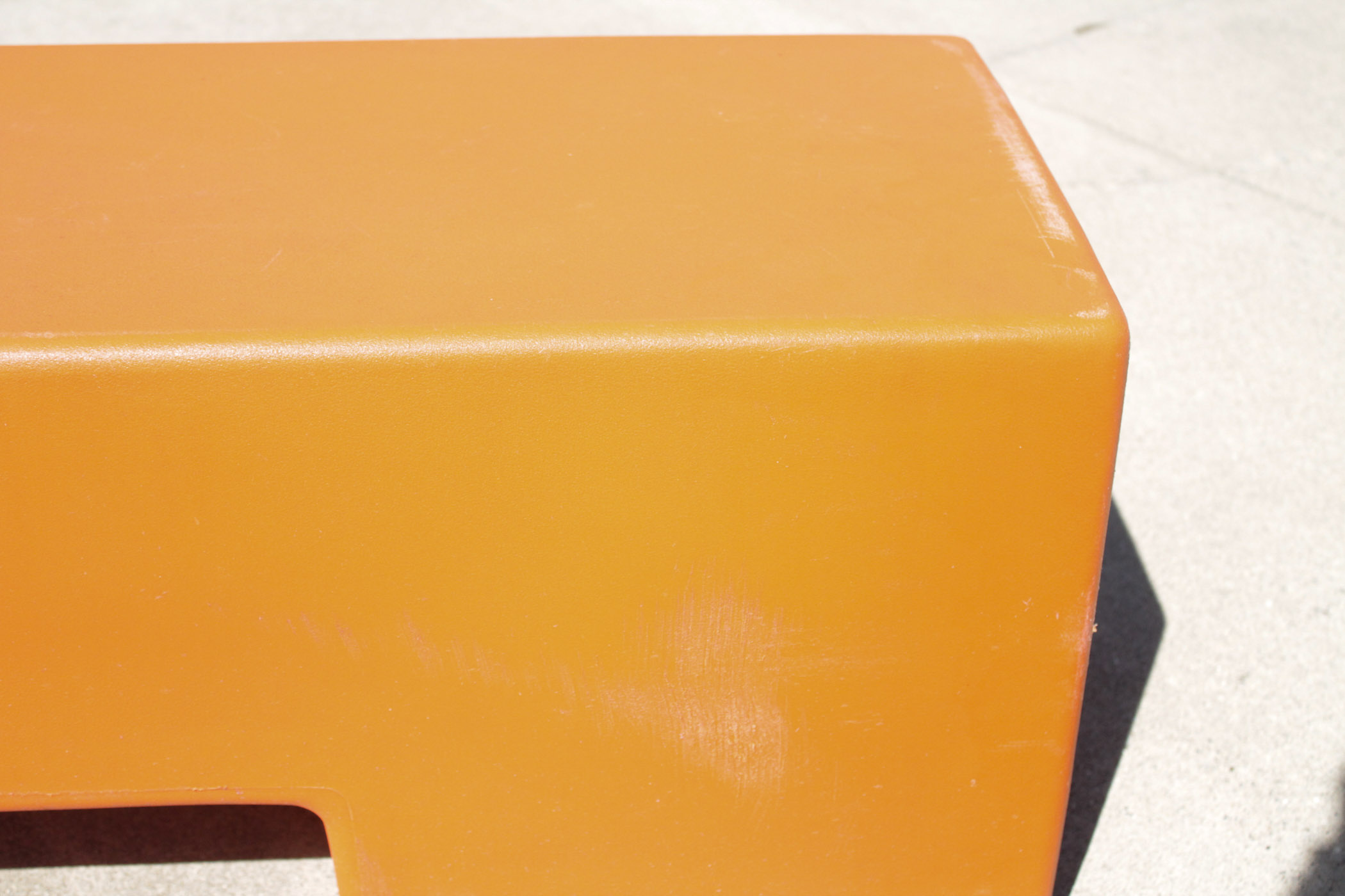 Orange Molded Plastic Bench