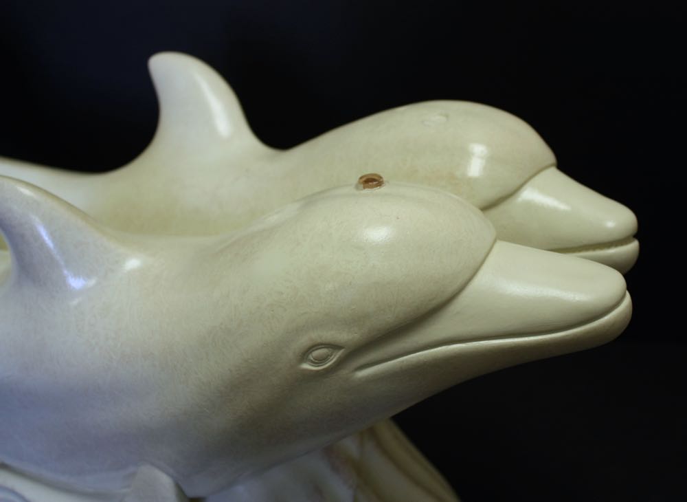 Glass Top Cocktail Table with Dolphin Base