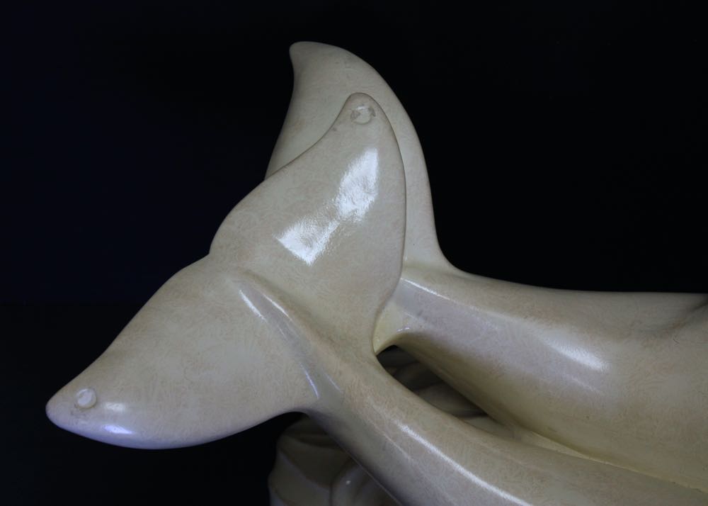 Glass Top Cocktail Table with Dolphin Base