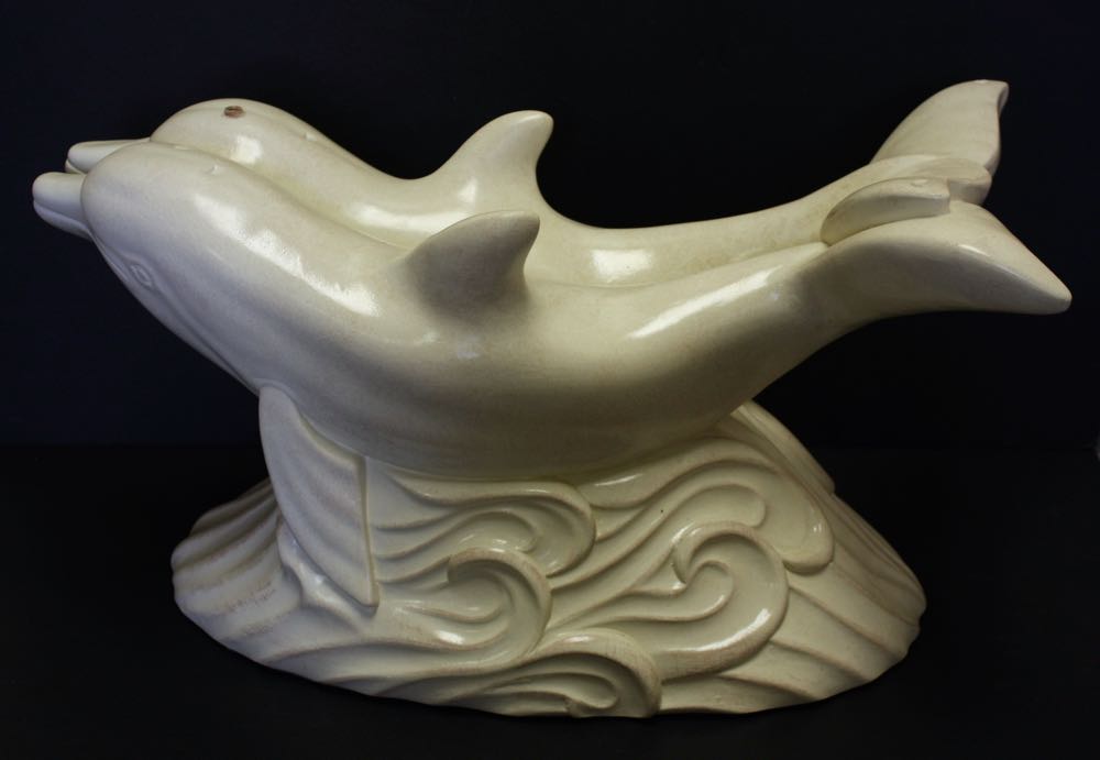 Glass Top Cocktail Table with Dolphin Base