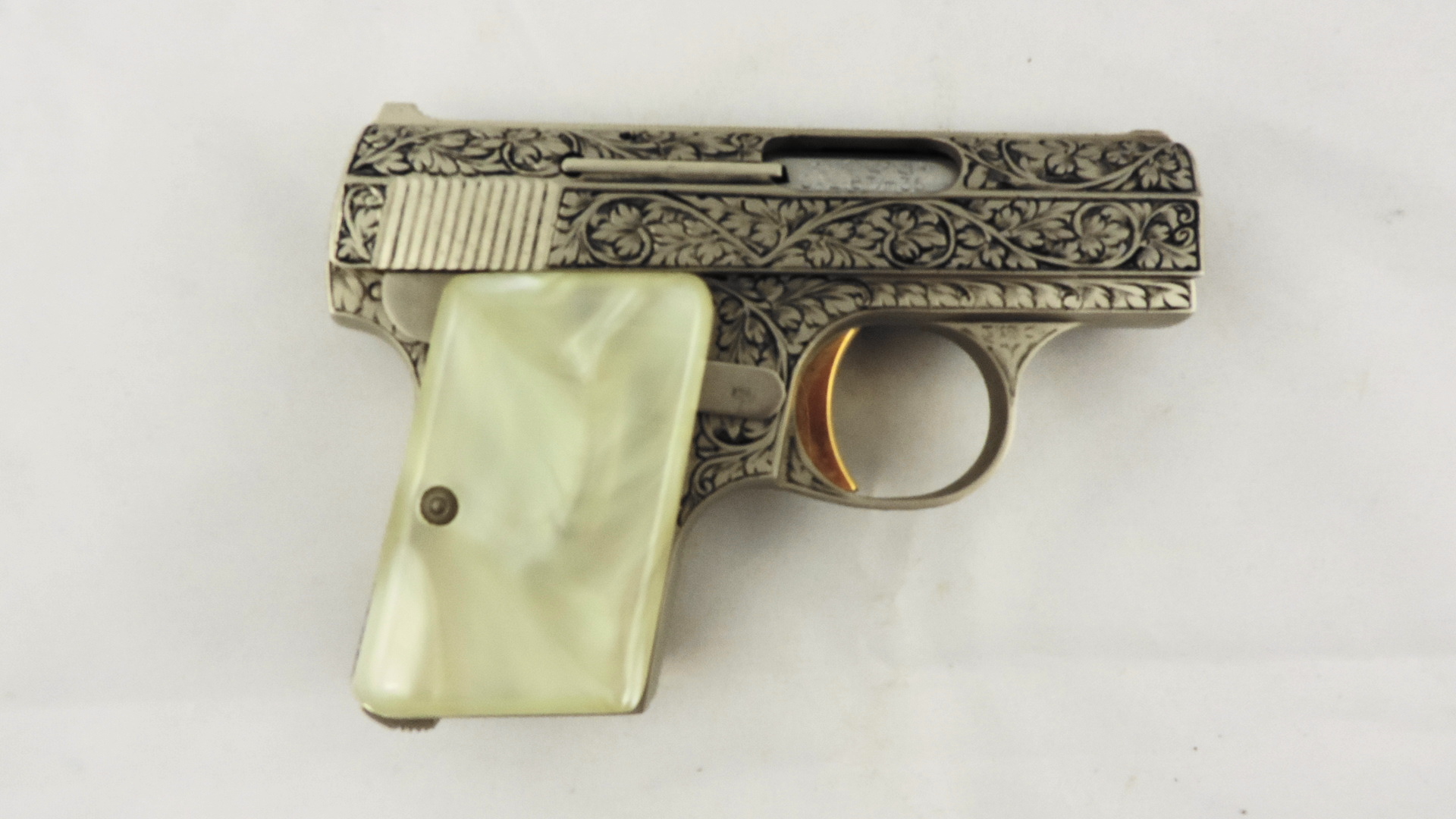 Baby Browning with Renaissance Engraving and Simulated Pearl Grip