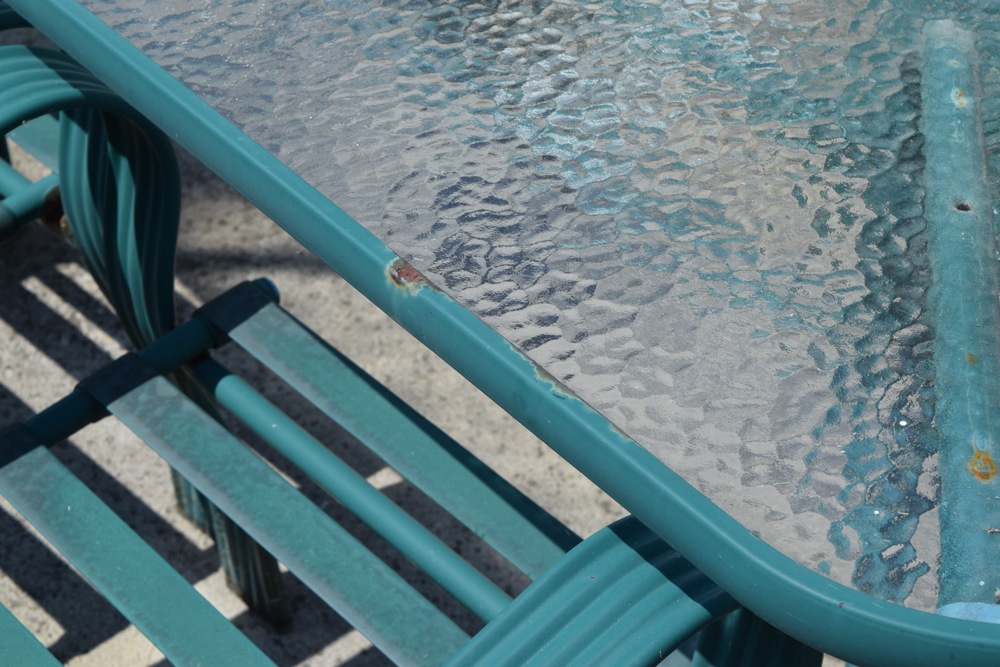 Green Metal and Glass Patio Table and Chairs