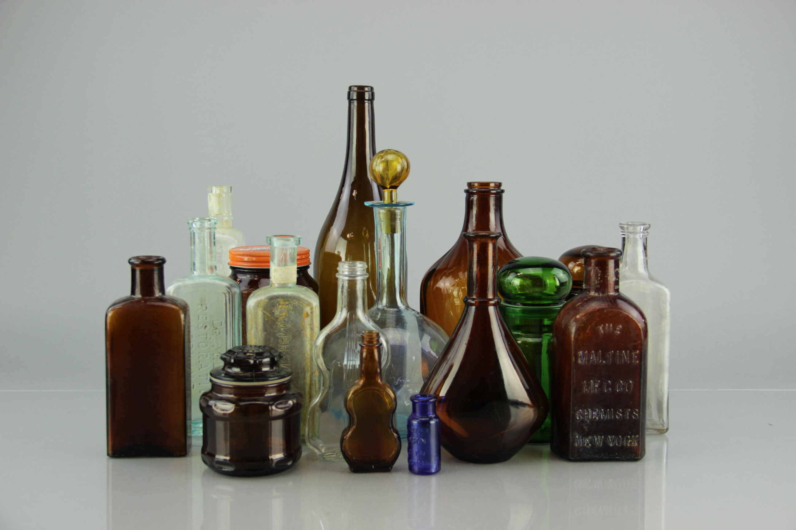 Collection of Antique Snake Oil and Other Bottles
