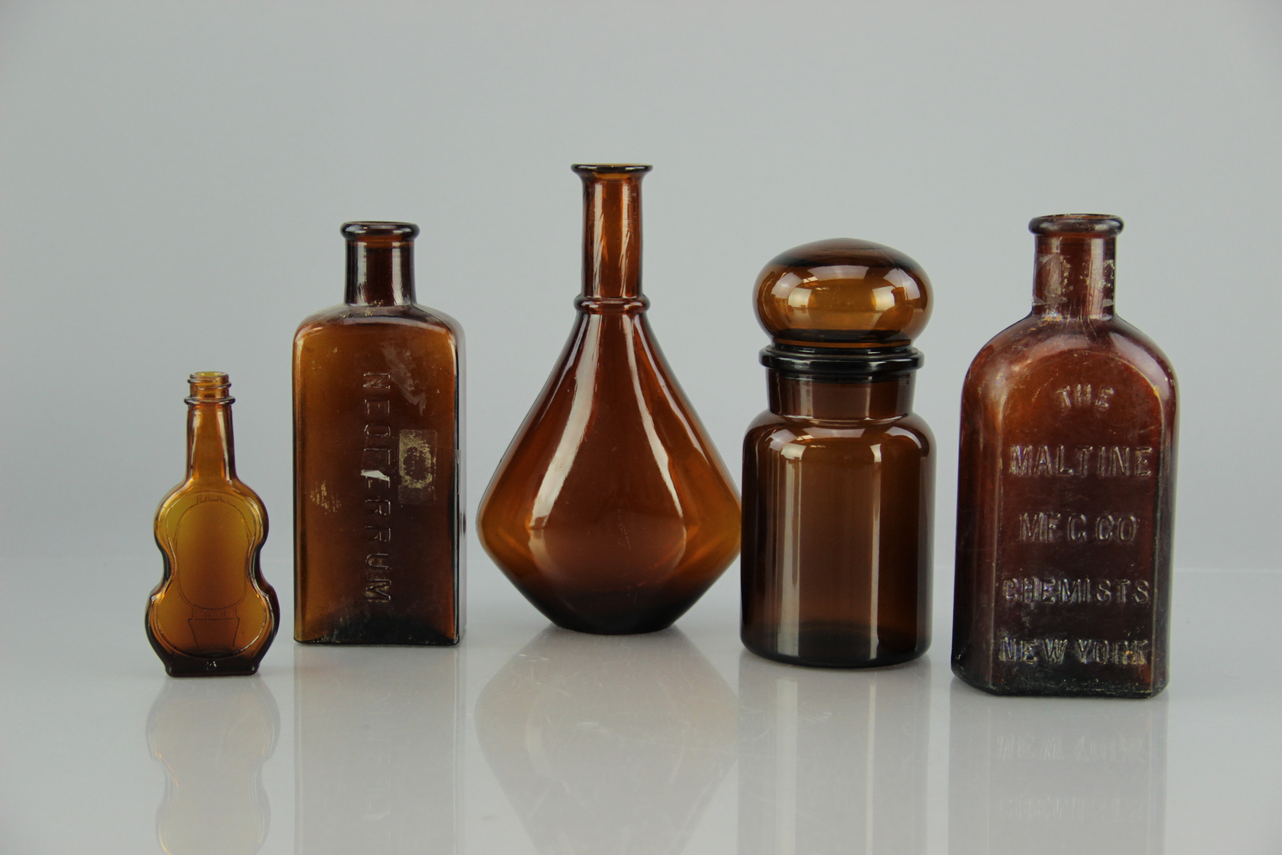 Collection of Antique Snake Oil and Other Bottles