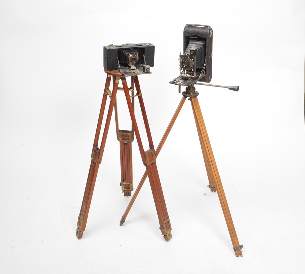 Pair Of Antique Tripods and Kodak Folding Bed Cameras
