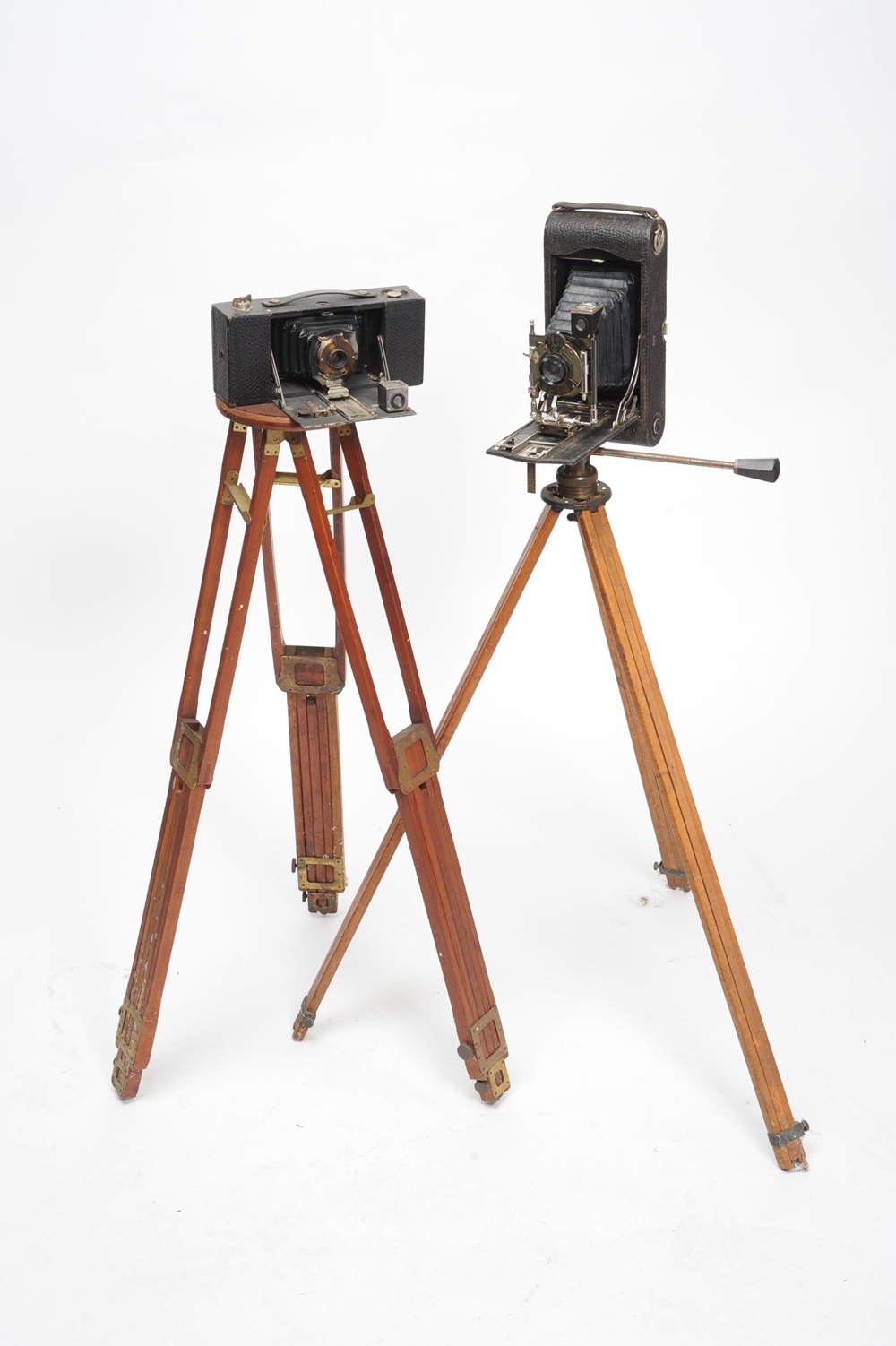 Pair Of Antique Tripods and Kodak Folding Bed Cameras
