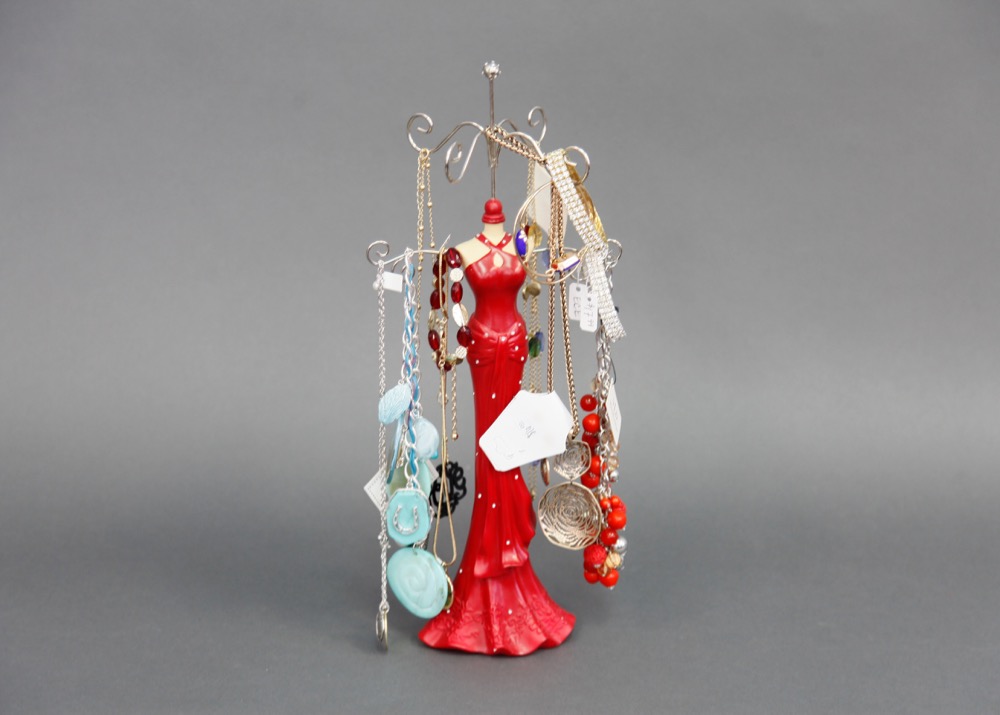 Woman in Red Dripping With Jewelry