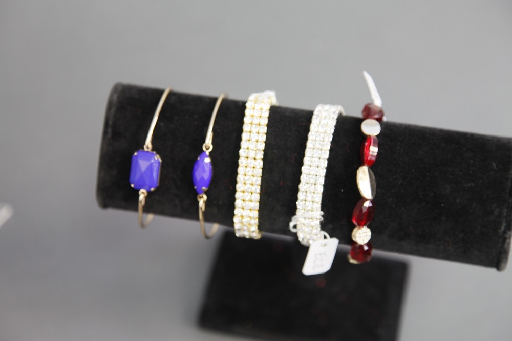 Woman in Red Dripping With Jewelry