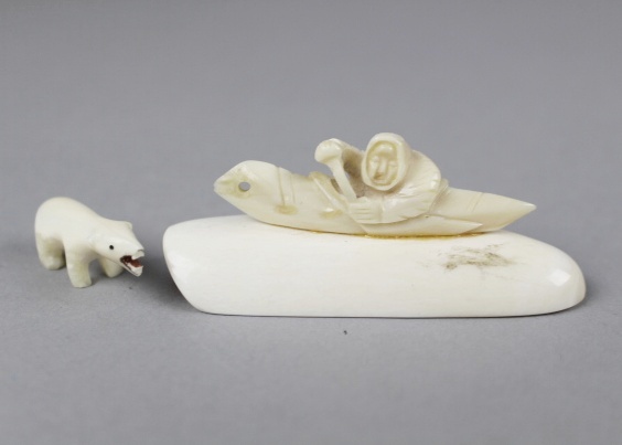 Carved Ivory Inuit in Canoe on Large Walrus Tooth and Polar Bear