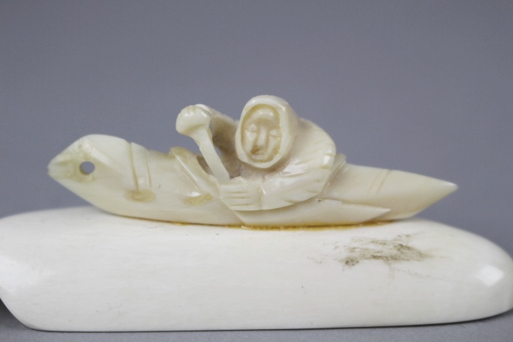 Carved Ivory Inuit in Canoe on Large Walrus Tooth and Polar Bear