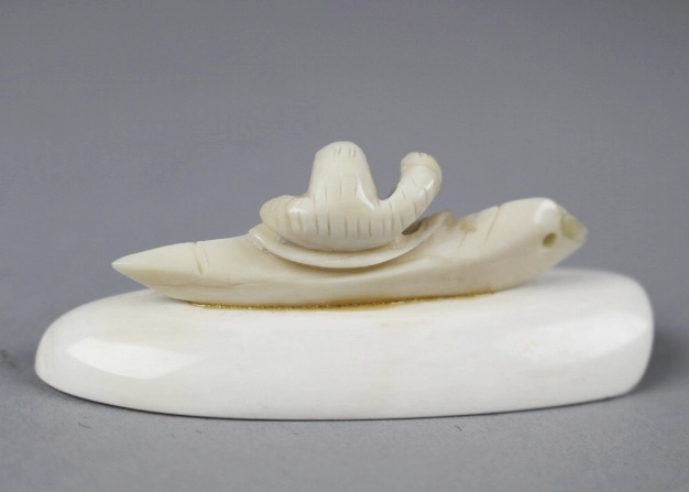 Carved Ivory Inuit in Canoe on Large Walrus Tooth and Polar Bear