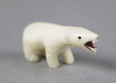 Carved Ivory Inuit in Canoe on Large Walrus Tooth and Polar Bear