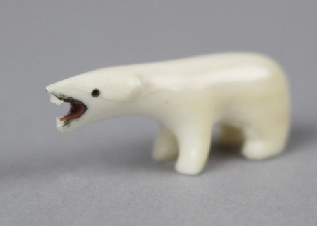 Carved Ivory Inuit in Canoe on Large Walrus Tooth and Polar Bear