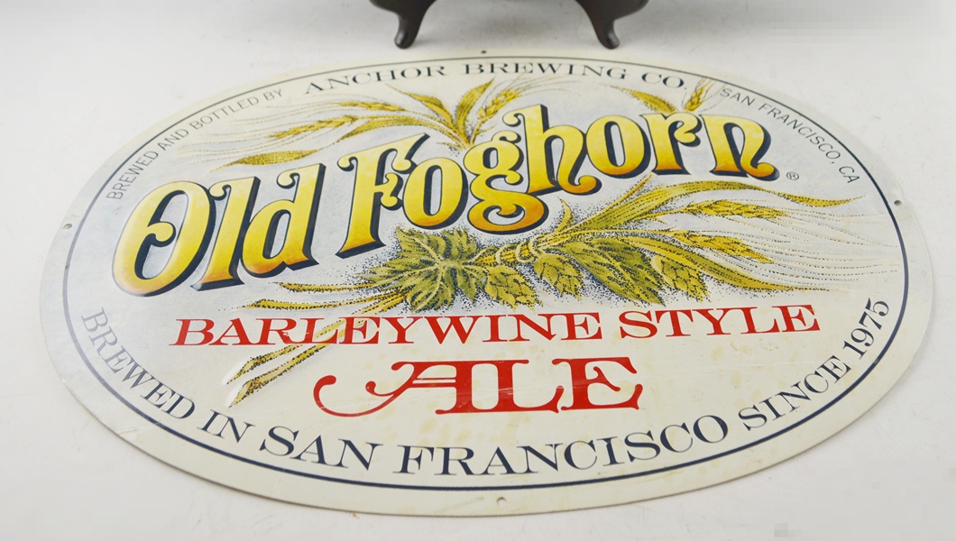 Two Vintage Tin Advertising Signs