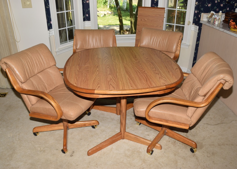 Oak Kitchen Table and Four Leather and Oak Swivel Chairs on Casters