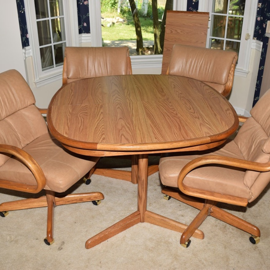 Oak Kitchen Table and Four Leather and Oak Swivel Chairs on Casters