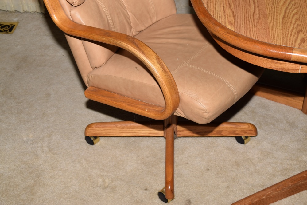 Oak Kitchen Table and Four Leather and Oak Swivel Chairs on Casters