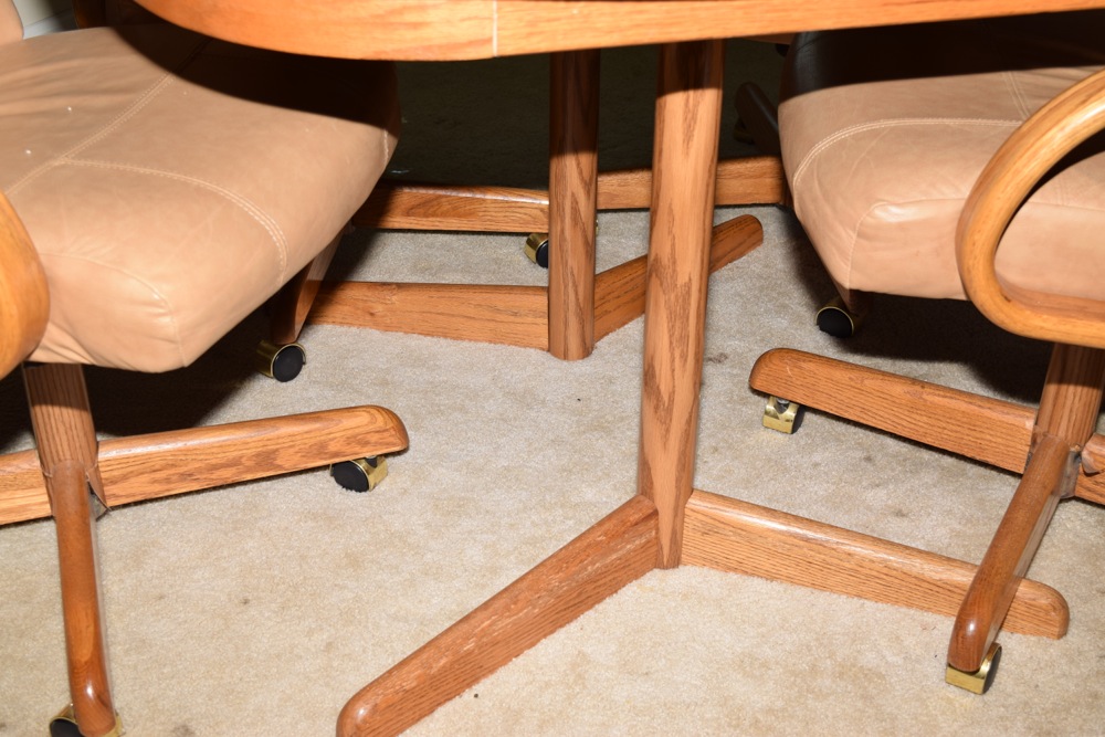 Oak Kitchen Table and Four Leather and Oak Swivel Chairs on Casters