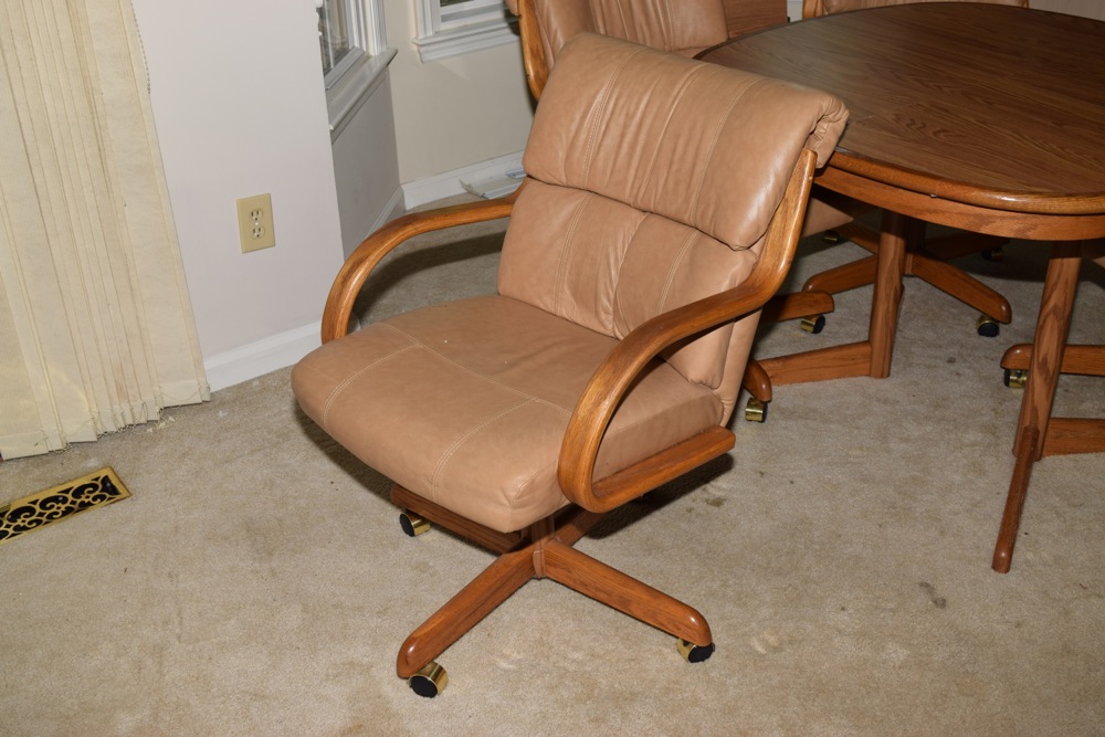 Oak Kitchen Table and Four Leather and Oak Swivel Chairs on Casters