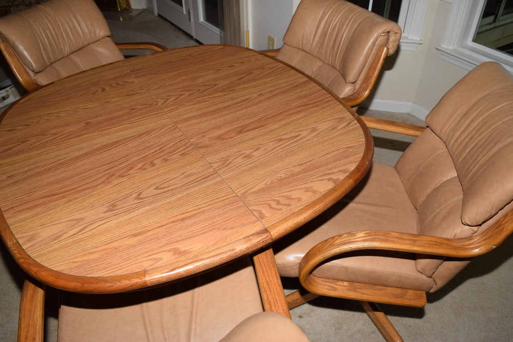 Oak Kitchen Table and Four Leather and Oak Swivel Chairs on Casters