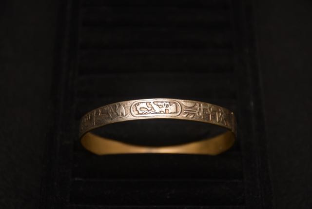 Four Ornate Bracelets Including one With an Egyptian Motif