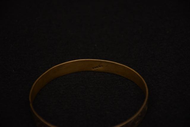 Four Ornate Bracelets Including one With an Egyptian Motif