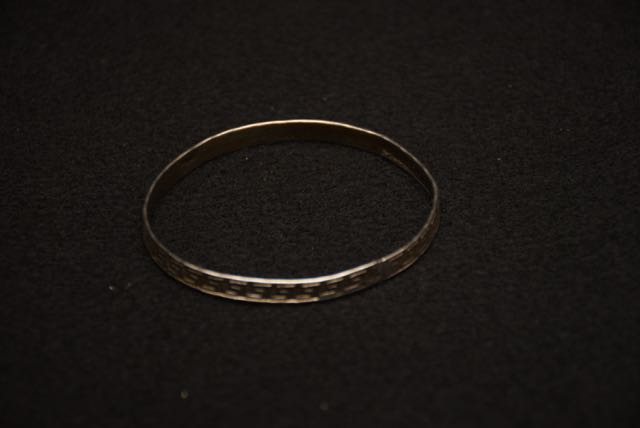 Four Ornate Bracelets Including one With an Egyptian Motif