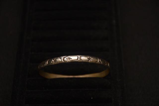 Four Ornate Bracelets Including one With an Egyptian Motif