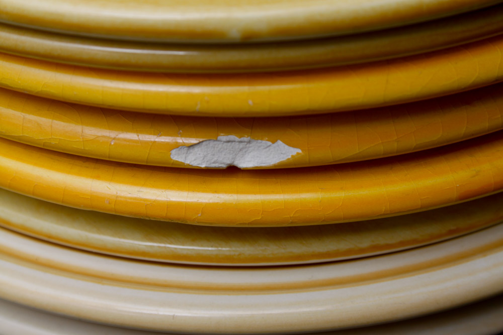 Assorted Yellow and White Ceramic Dishes