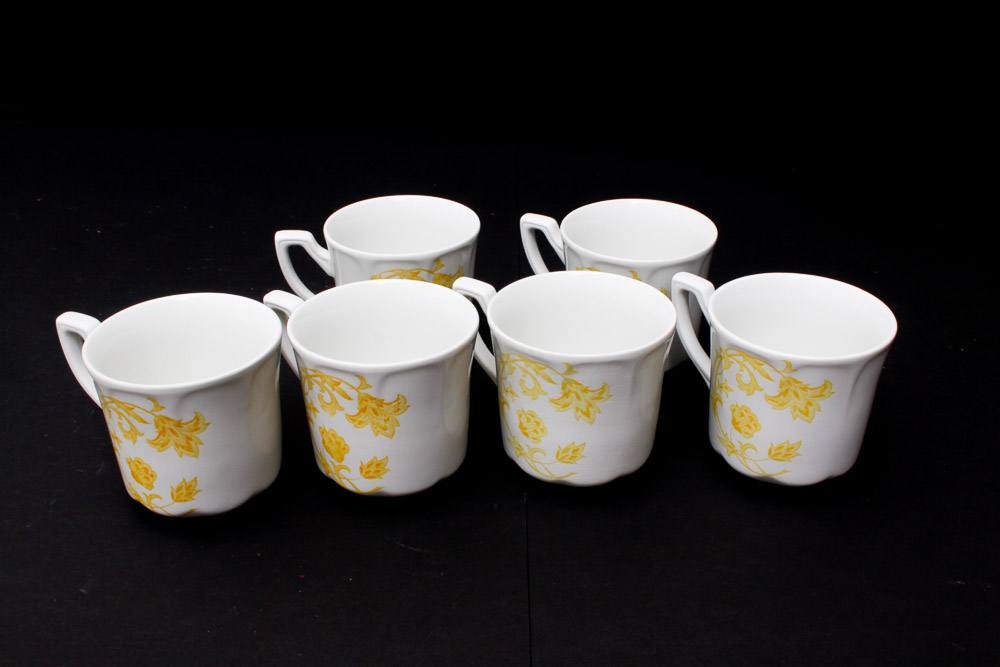 Assorted Yellow and White Ceramic Dishes