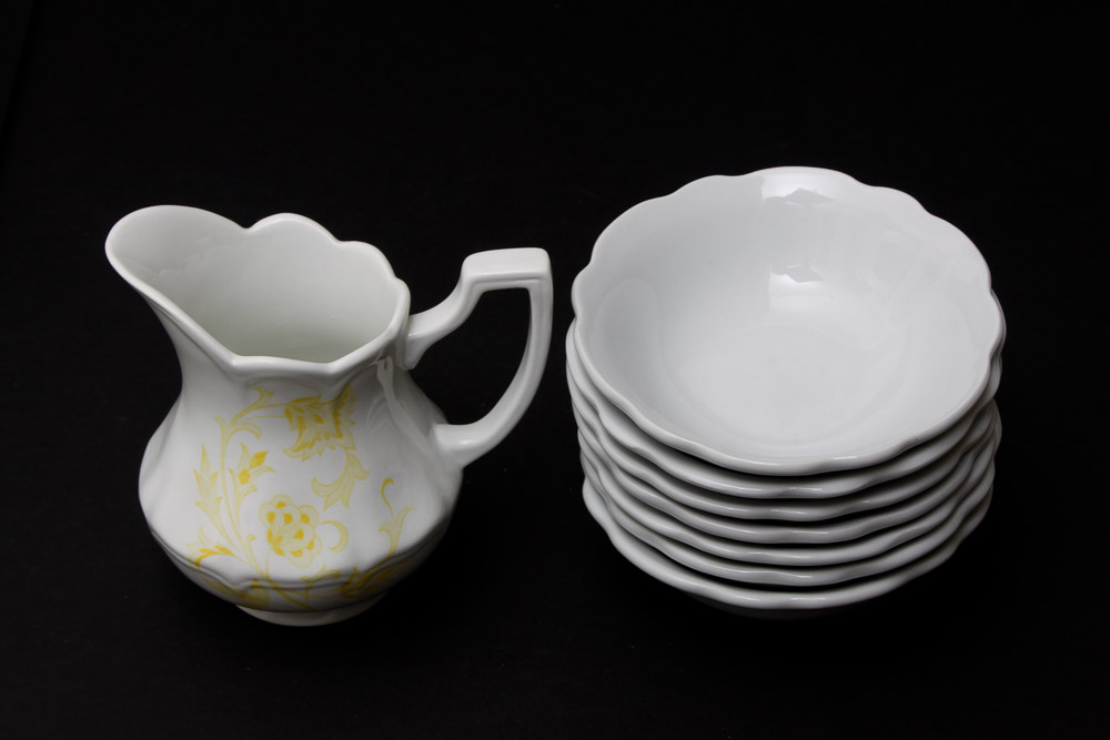 Assorted Yellow and White Ceramic Dishes