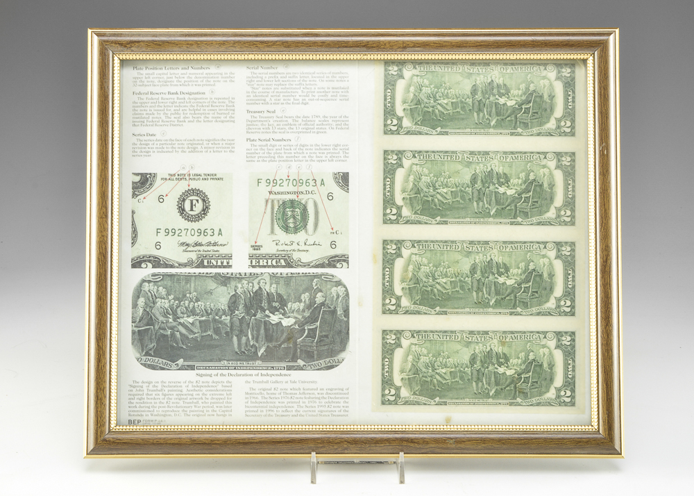 A Framed Uncut Two Dollar Bill Sheet