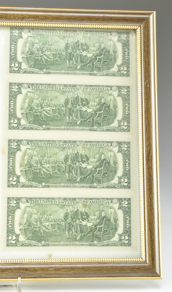 A Framed Uncut Two Dollar Bill Sheet