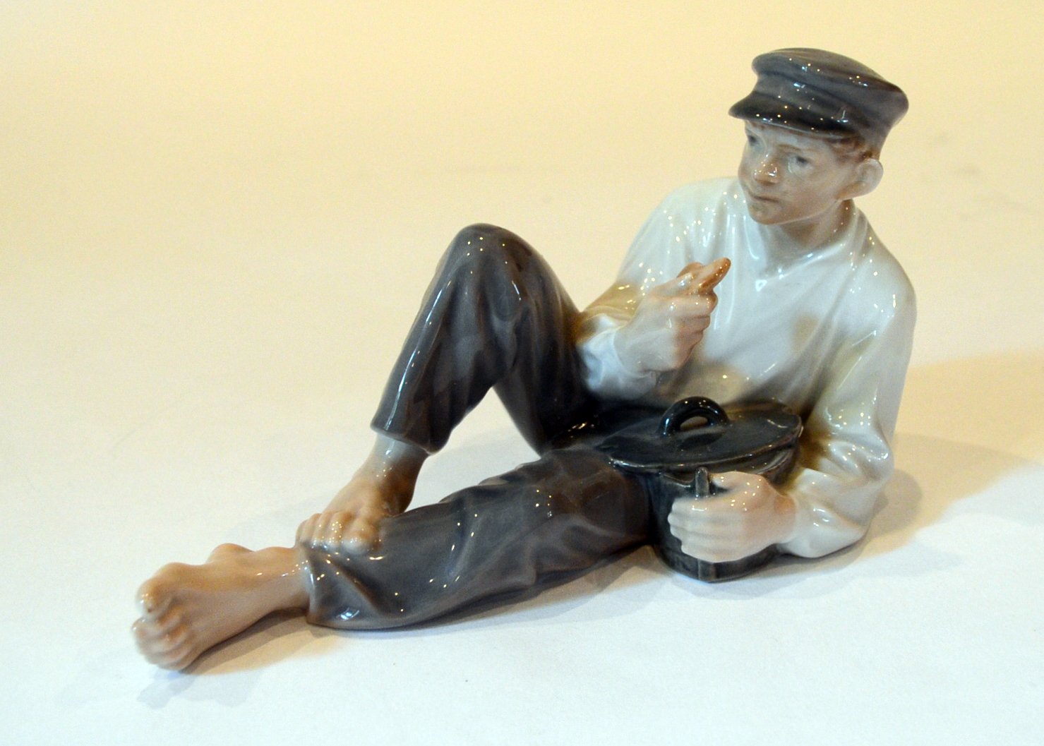 Royal Copenhagen "Boy At Lunch" Figurine
