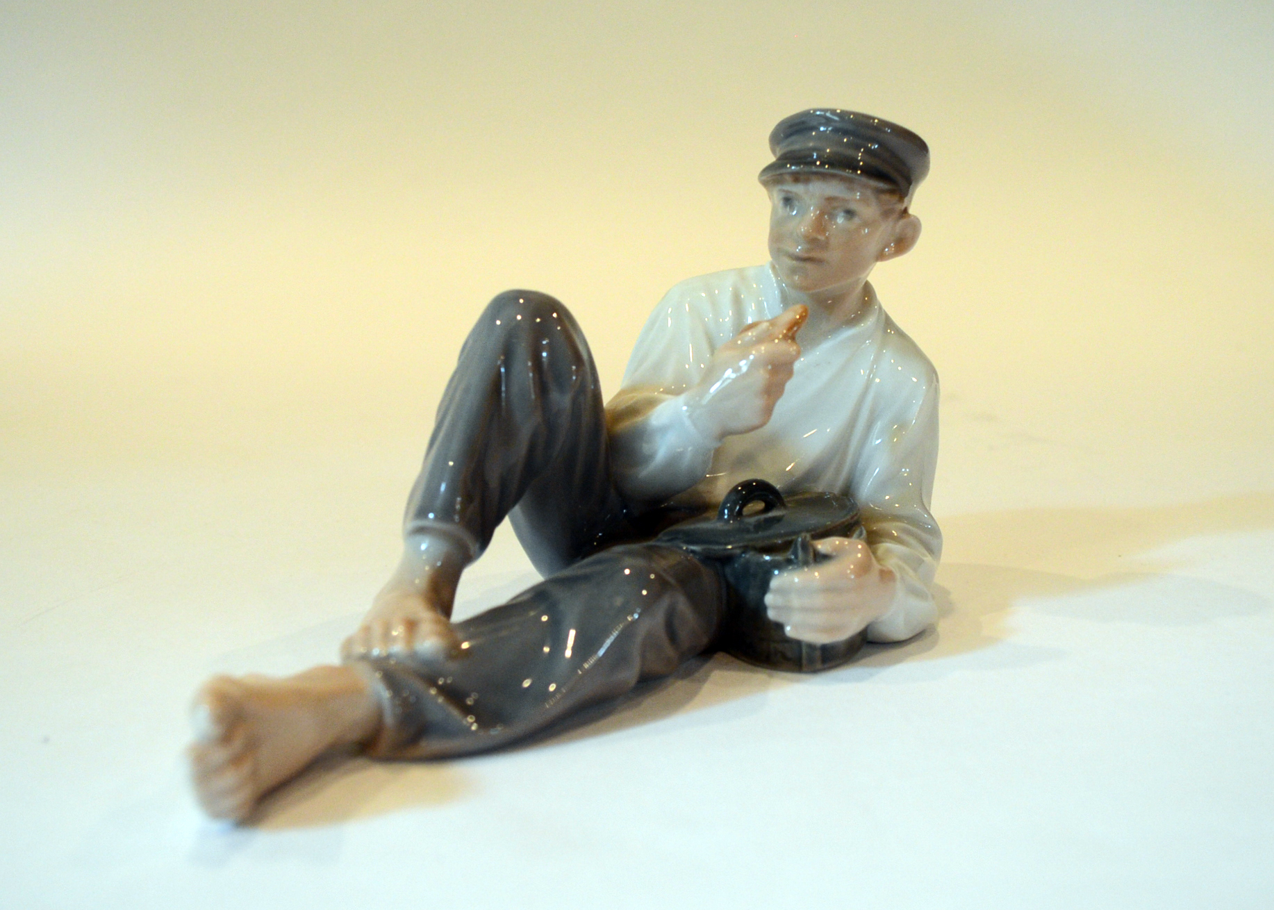 Royal Copenhagen "Boy At Lunch" Figurine