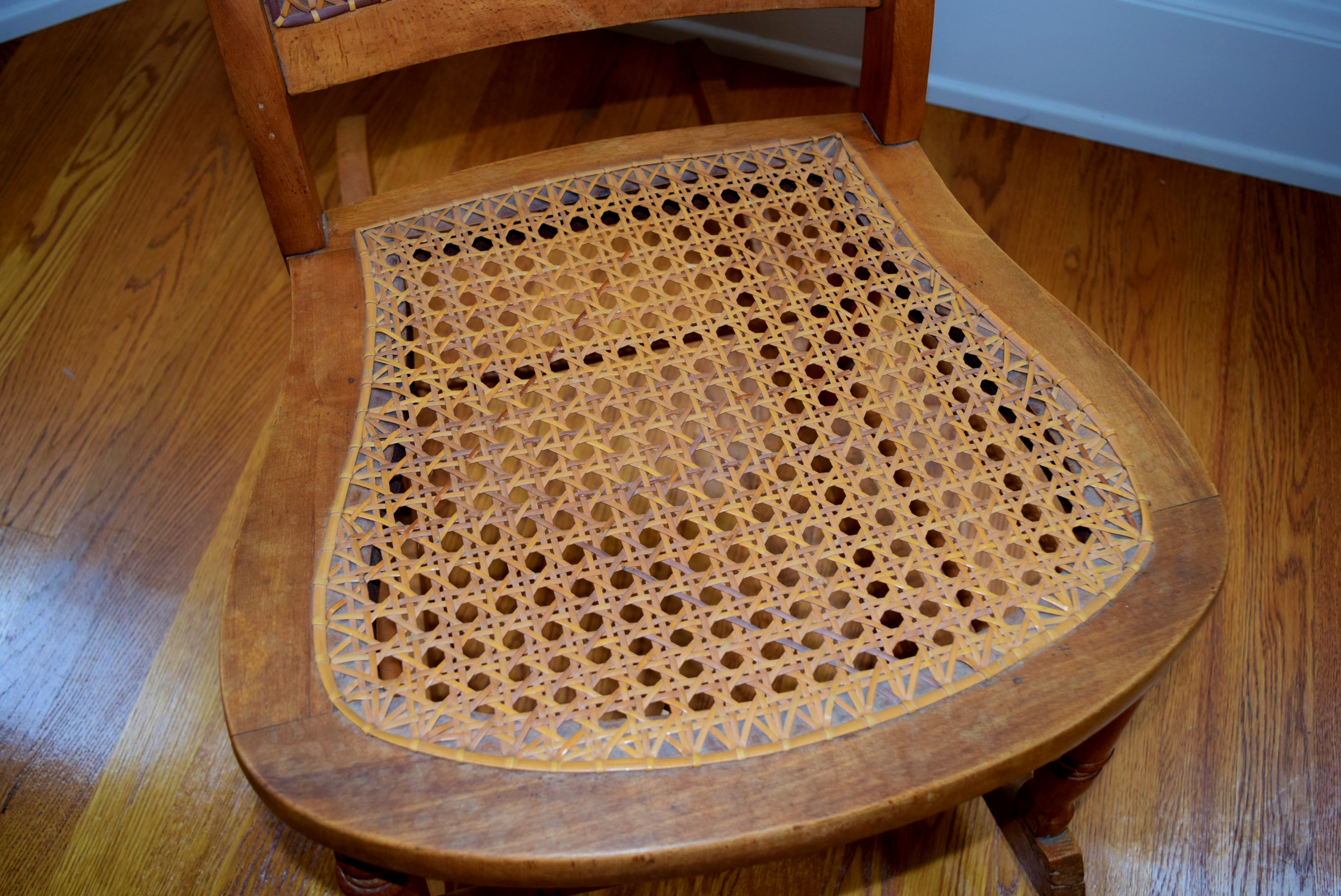 Armless Cane Back Rocking Chair