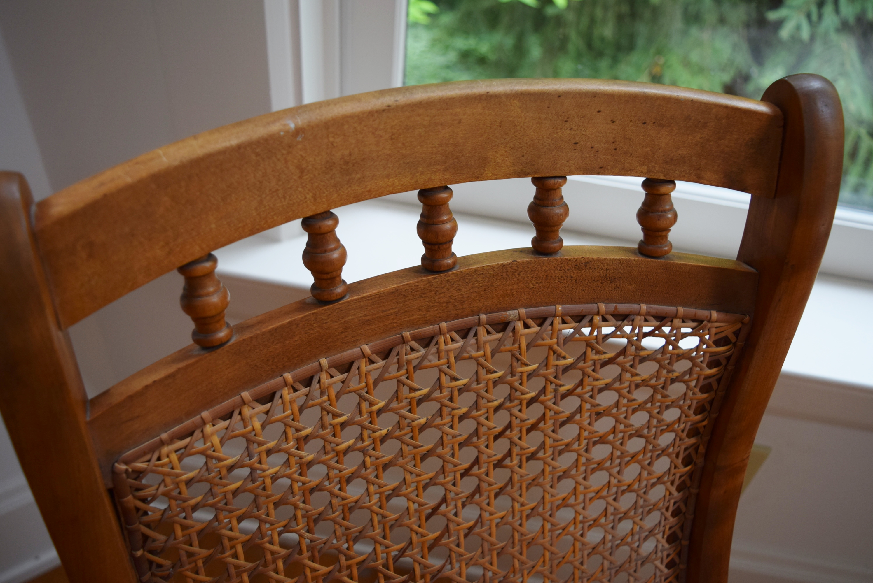 Armless Cane Back Rocking Chair