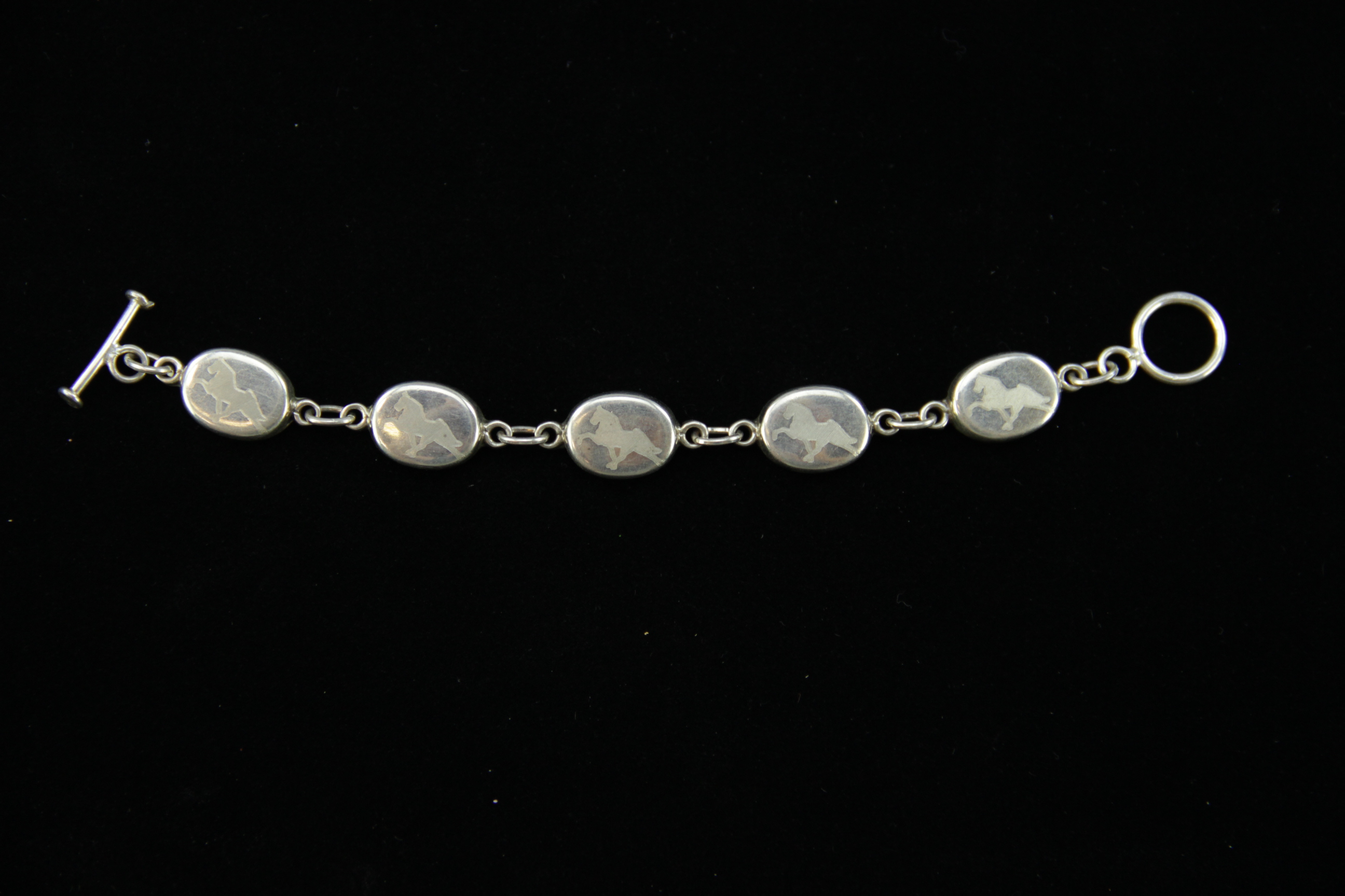 Pair of Sterling Silver Horse Bracelets