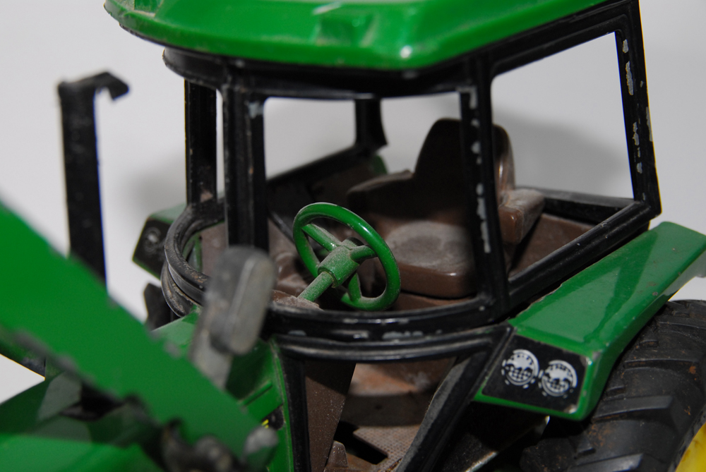 A Pair of Metal Tractor Toys