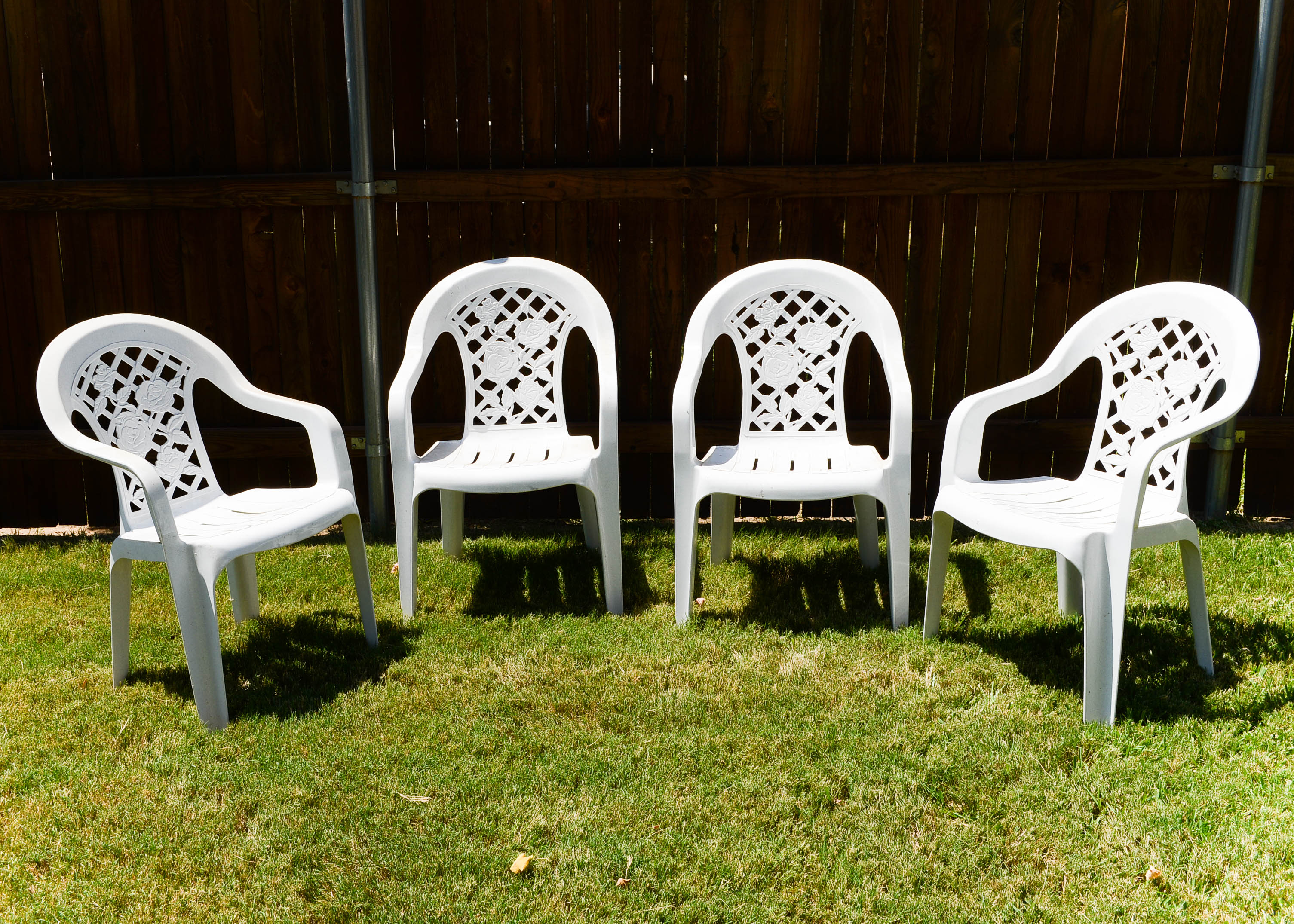Four Plastic Outdoor Chairs