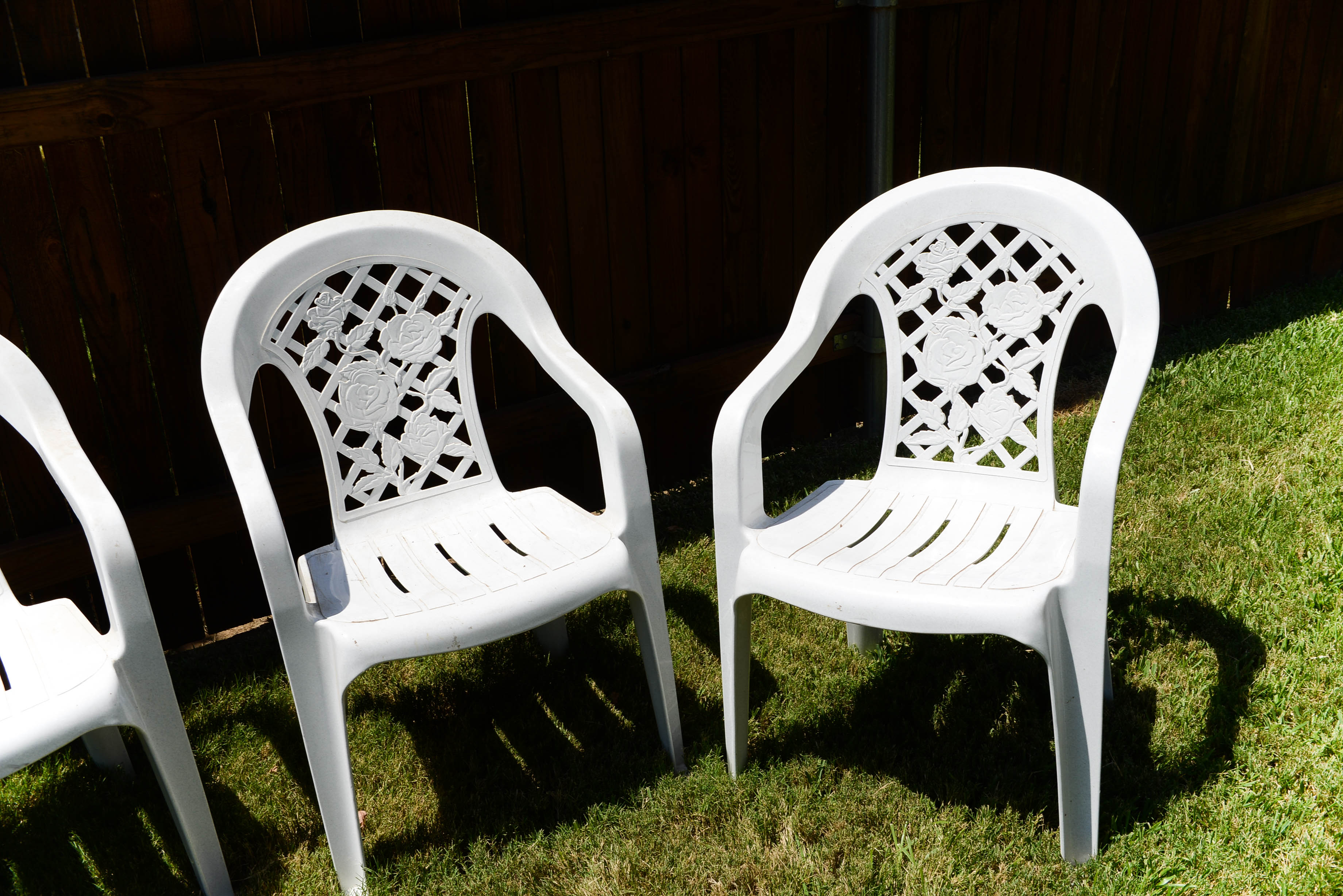 Four Plastic Outdoor Chairs