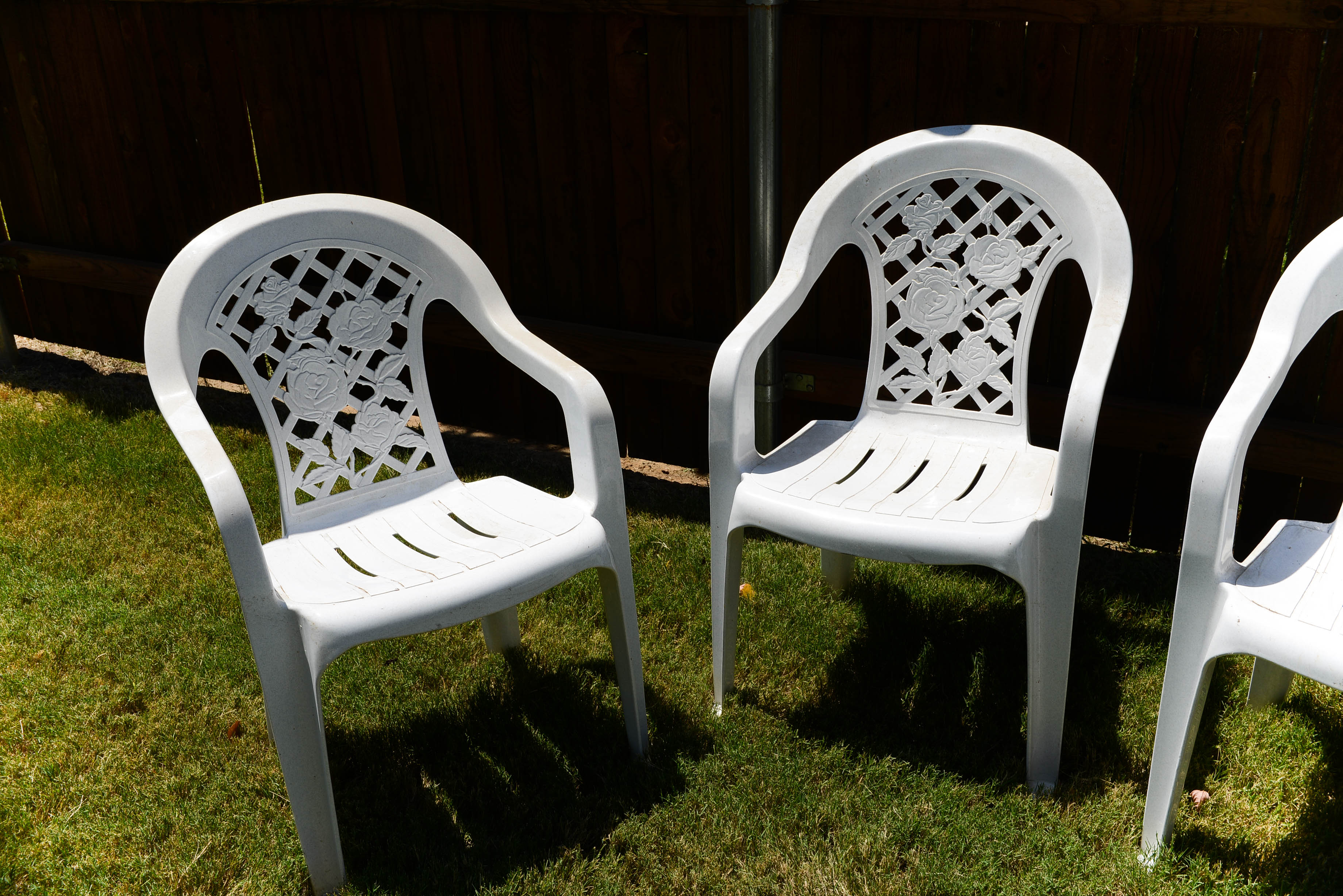 Four Plastic Outdoor Chairs