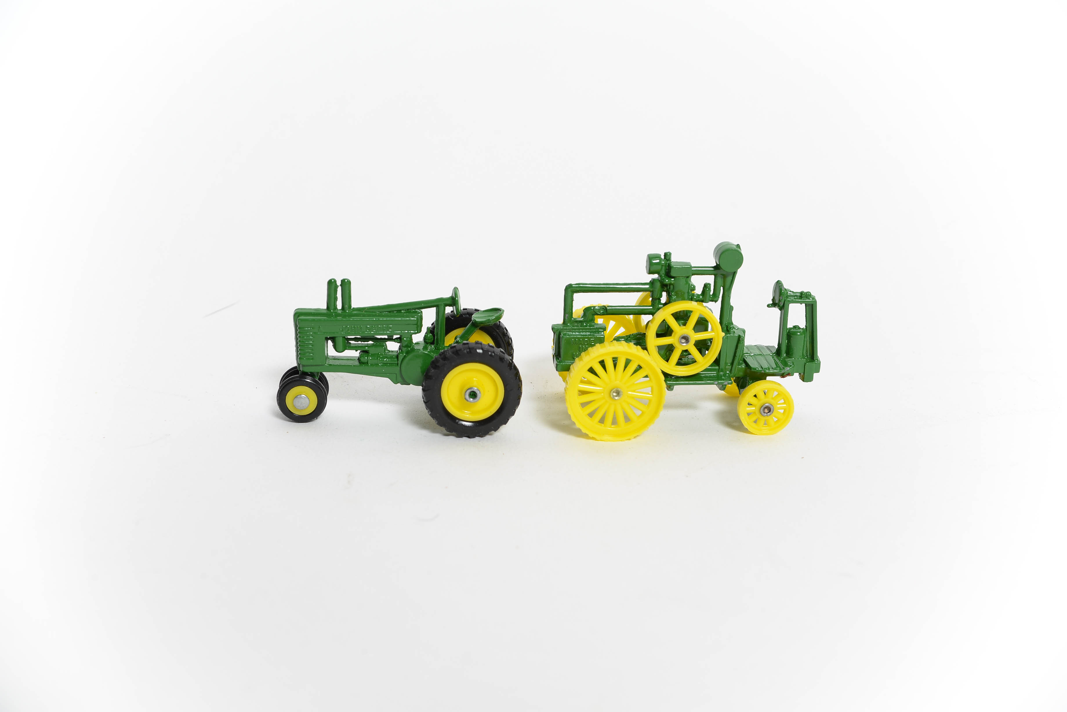 Seven John Deere Miniature Toy Tractors