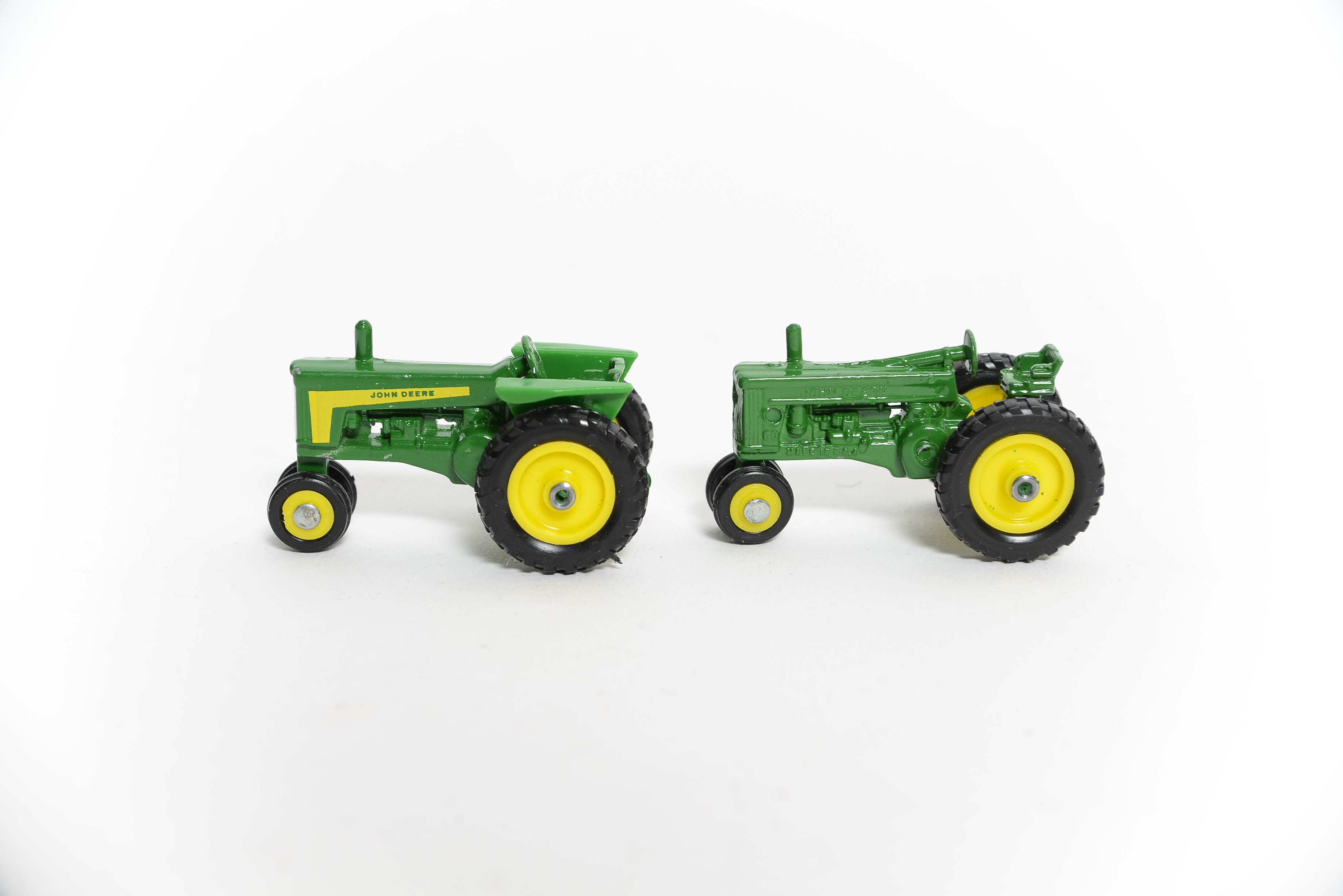 Seven John Deere Miniature Toy Tractors