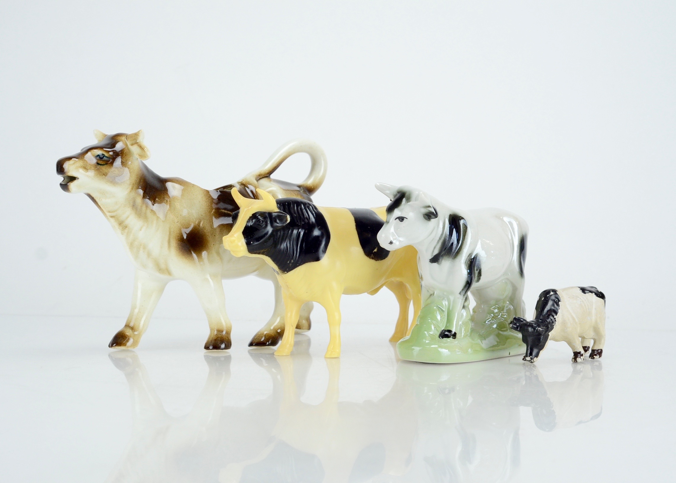 Collection of Four Vintage Cow Figurines